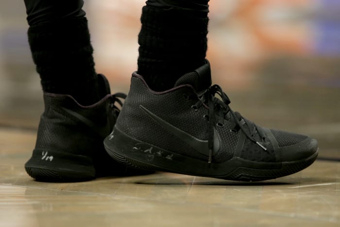 View of black Nike Kyrie shoes.
